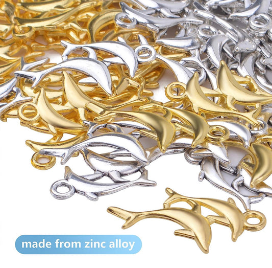 Silver and gold dolphin charms